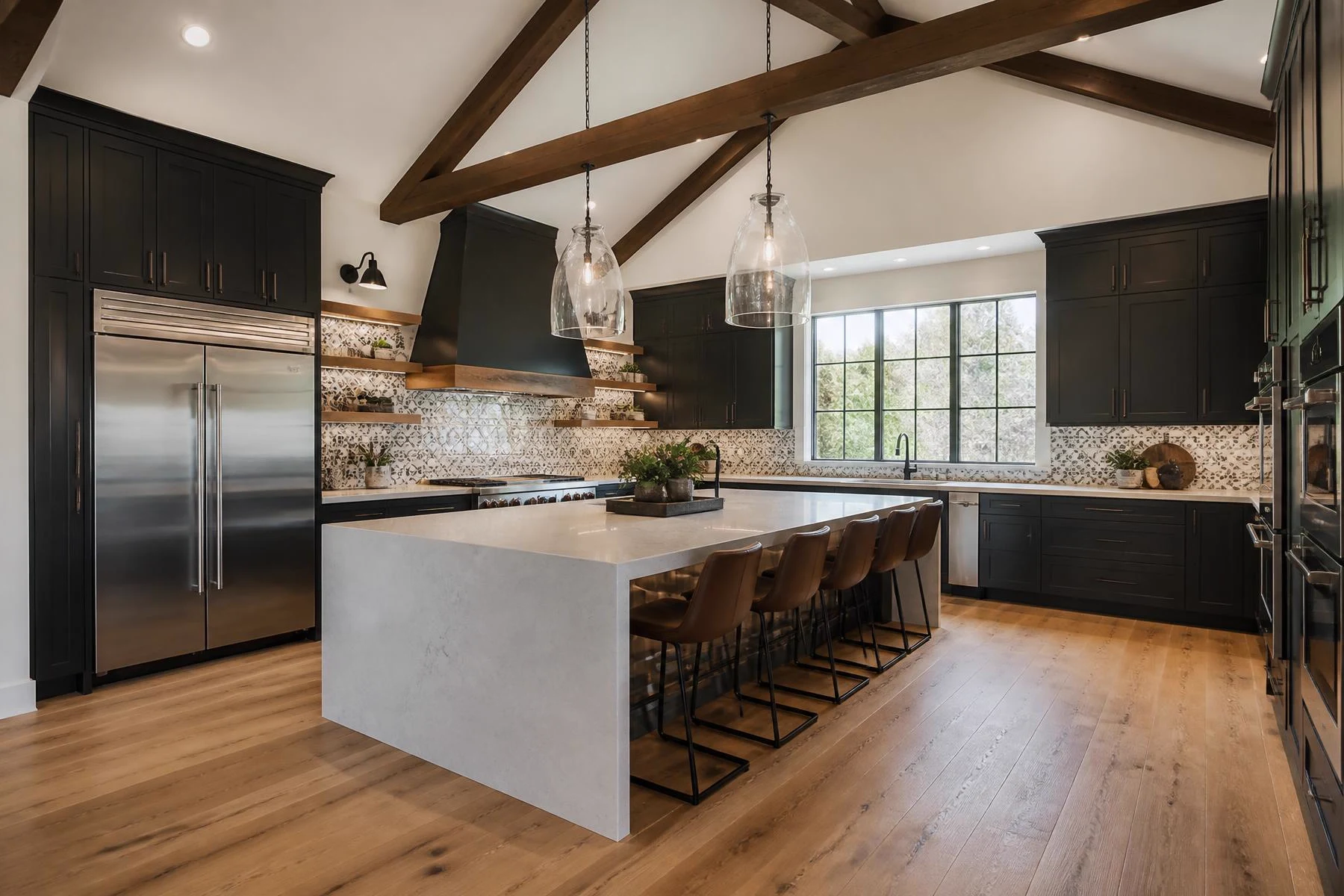 Custom kitchen renovation by Maydus with stone island, cabinetry and layered lighting