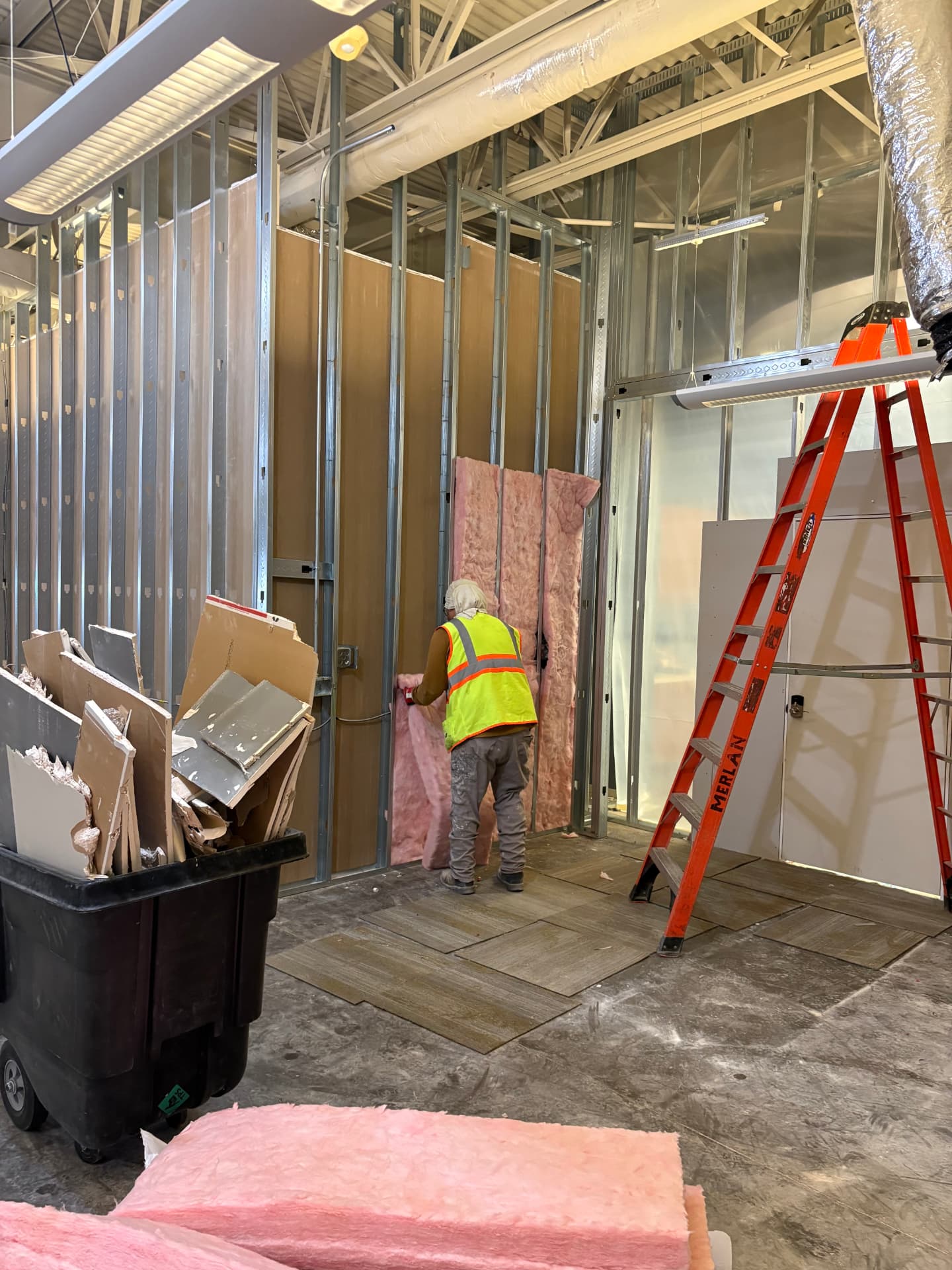Commercial interior build-out by Maydus with new framing, ceiling grid and finishes